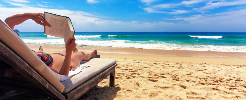 Relaxing on the beach Relaxing And Reading On The Beach